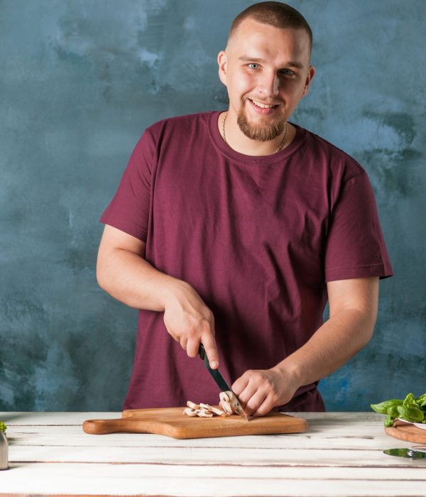 closeup-hand-chef-baker-making-pizza-kitchen-min